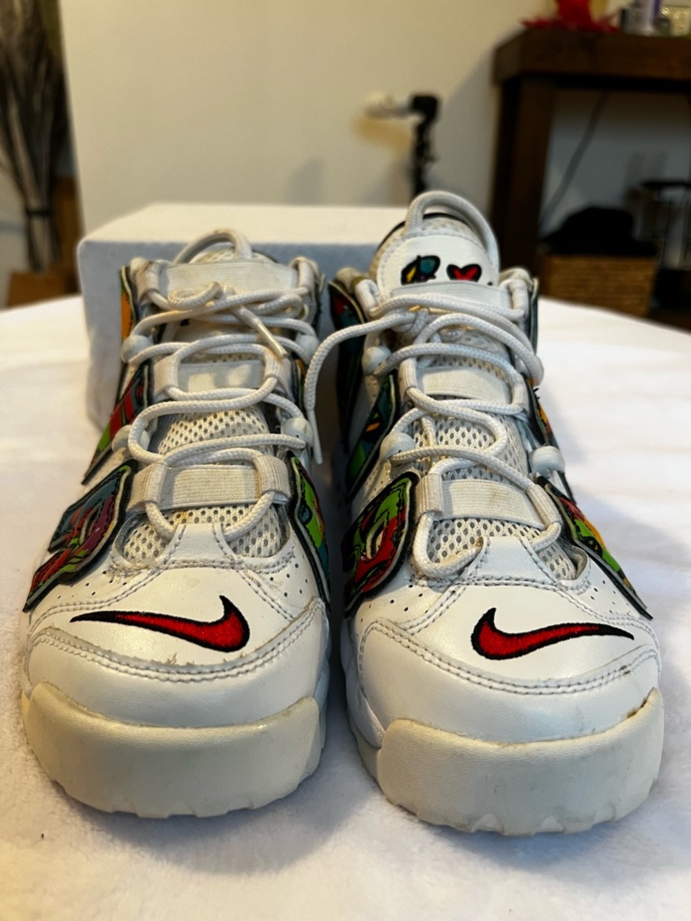 Nike Kids White Sneakers with Red Swoosh and Multicolor Graphics